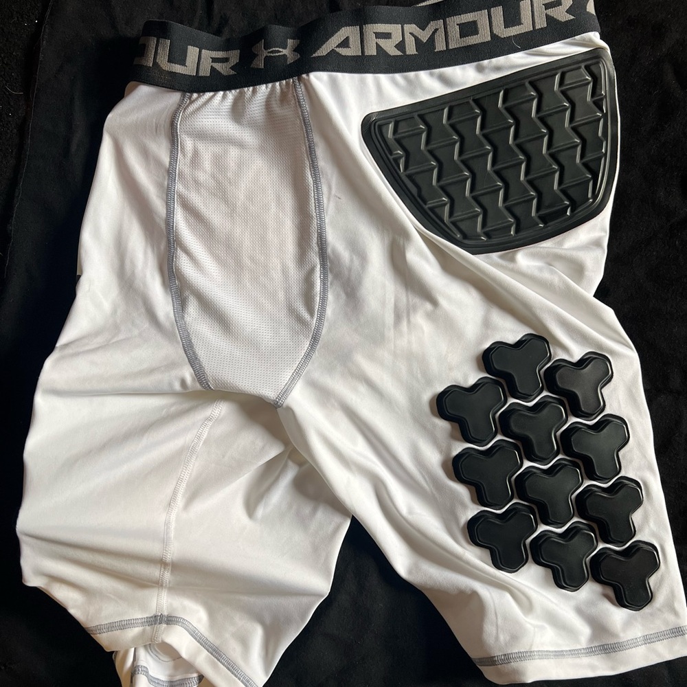Under Armour Heat Gear padded football shorts. Size XXL.  Brand new no tags.